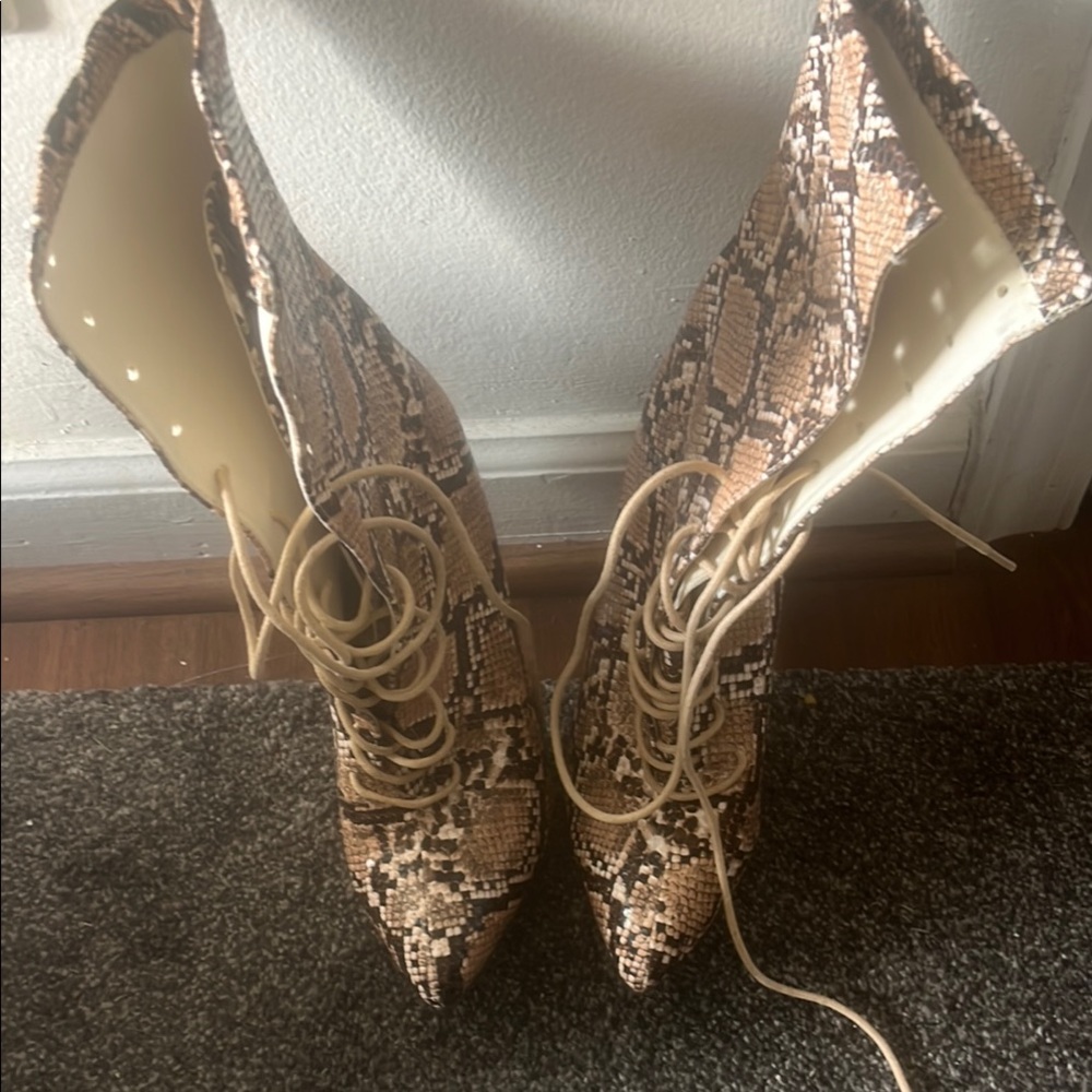 Brown Lace Up Boots with Elegant Design and Intricate Material